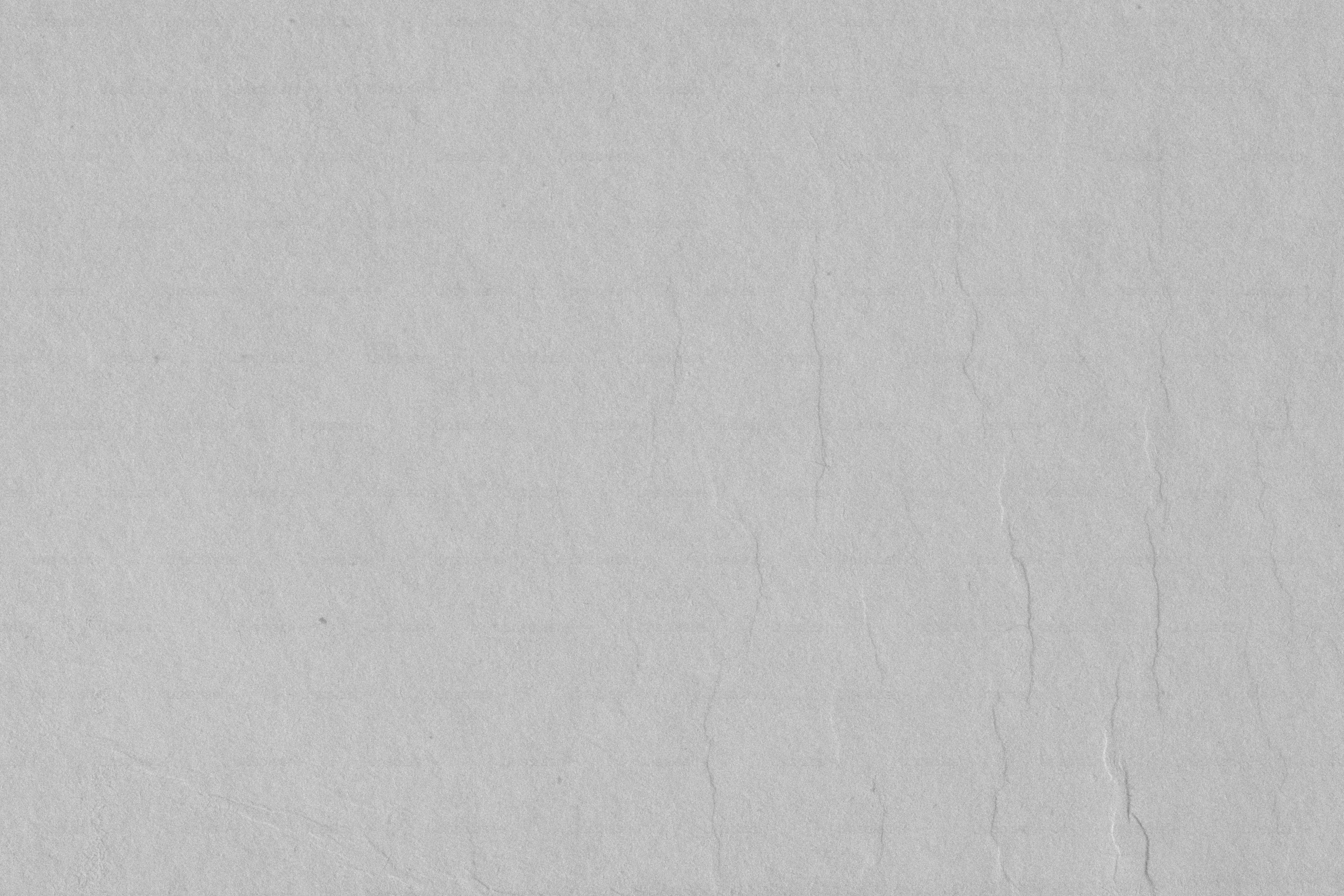 a black and white photo of a white wall